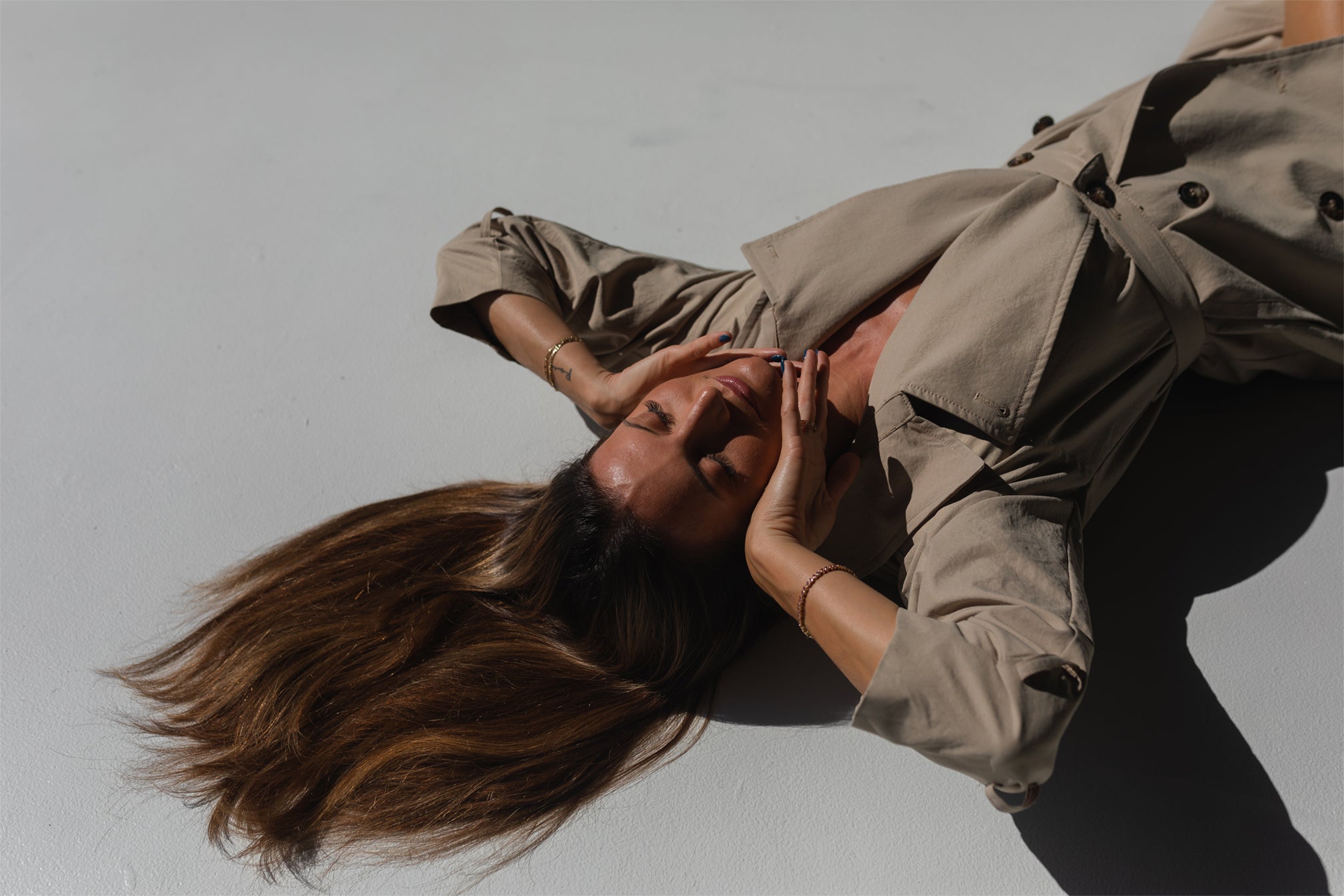 Woman lying in sun with long Vera Hair Co extensions